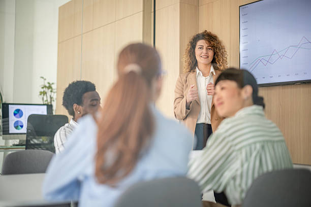 istock Successful business women collaborating in a modern office setting during a team meeting 2209565658
