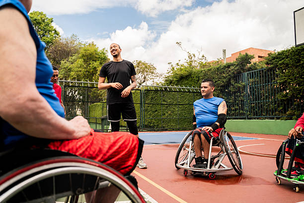 istock Instructor talking with athletes on a sports court 2209566574