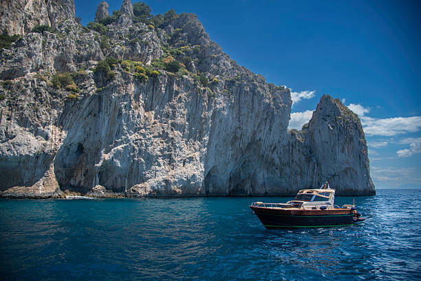 The island of Capri, located off the coast of southern Italy in the Bay of Naples, is a breathtaking Mediterranean gem known for its natural beauty, luxury charm, and ancient history