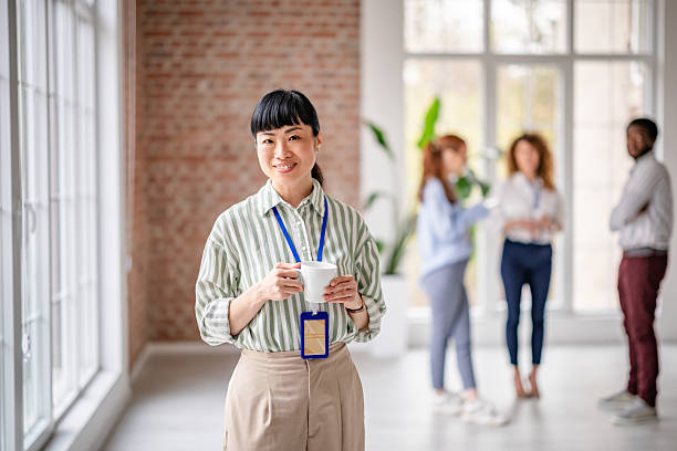 istock Collaborative teamwork in a modern office promotes positivity and diversity among professionals 2209566883