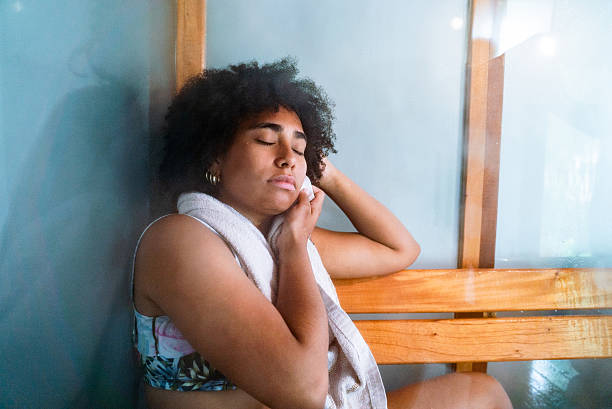 istock Young woman relaxing in the sauna at a spa 2209572087