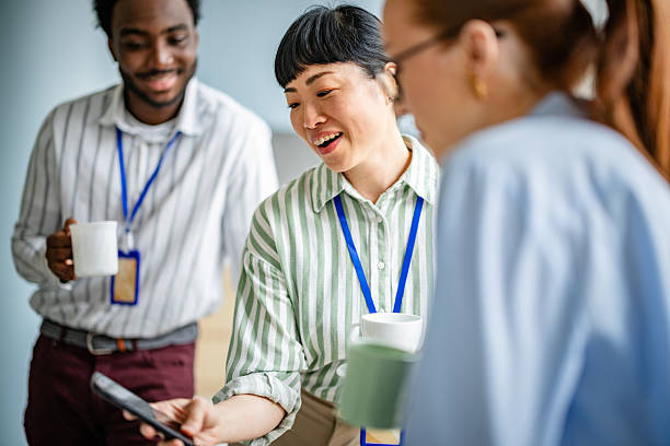 istock Engaging teamwork in a modern office environment fosters collaboration and positivity among diverse professionals 2209573055
