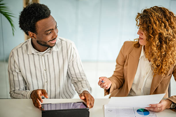 istock Multiracial group collaborating in a modern office setting focused on teamwork and innovative business strategies 2209573507