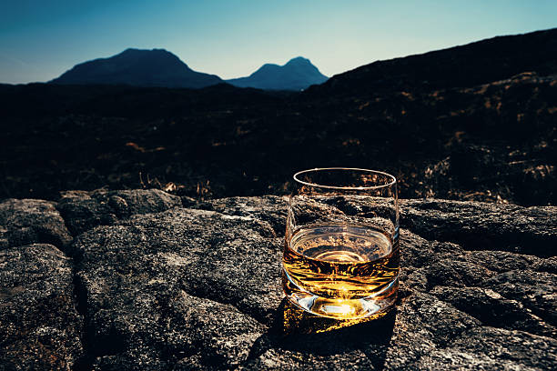 istock Whisky glass with a view, , Sutherland, Scotland 2209573960