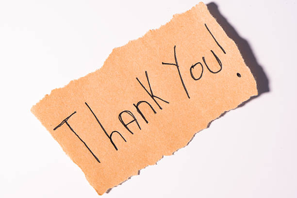 istock A Thank you note on brown paper, on a white background 2209575300