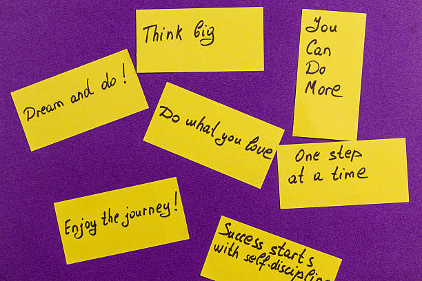 Encouraging quotes on sticky notes for personal motivation and growth