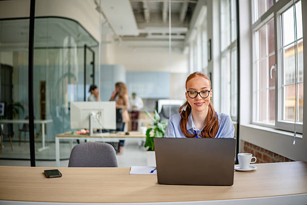 istock Women collaborating in a modern office environment, fostering teamwork and positive communication 2209576311