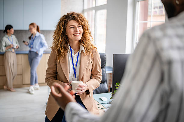 istock Collaboration and teamwork in a modern office with diverse professionals engaging in discussions 2209579443