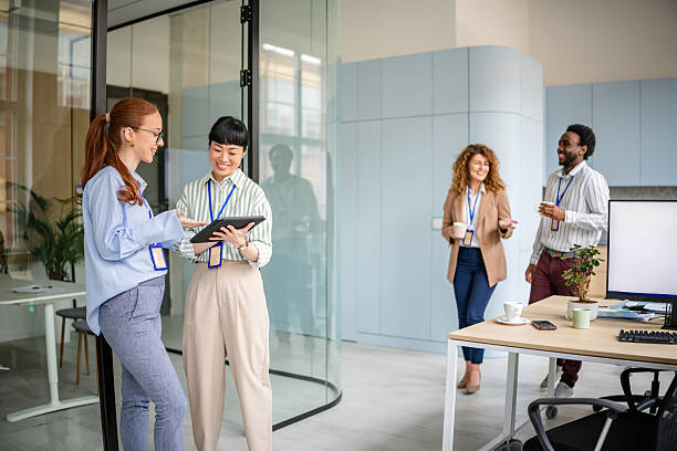 istock Modern office teamwork among diverse women fosters creativity and collaboration in a professional environment 2209579606