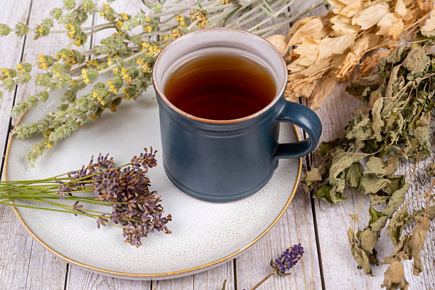 istock Green tea or herbal tea with cup, sugar lavender and dry herbs 2209580318