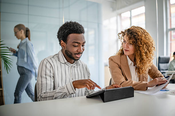 istock Collaboration and discussion in a modern office environment with diverse professionals engaged in teamwork 2209582490