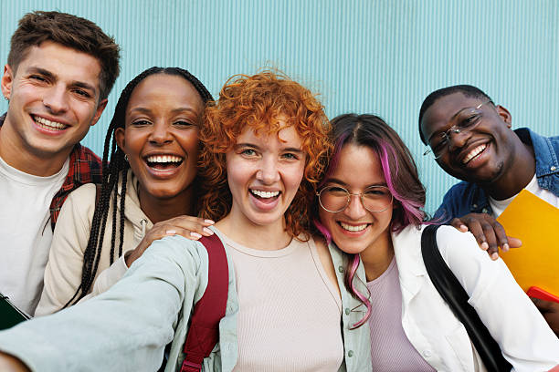 istock Cheerful university students taking a selfie together outdoors 2209583657