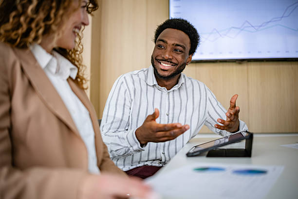 istock Diverse professionals engaged in a productive meeting in a modern office, focusing on teamwork and positive communication 2209583705