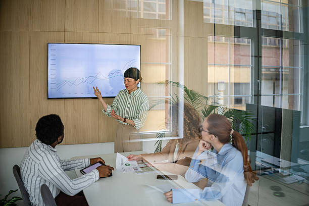 istock Team collaboration in a modern office with diverse professionals engaged in a meeting 2209583974