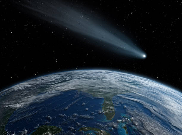 istock Comet, asteroid, meteorite flying to the planet Earth.  Glowing asteroid and tail of a falling comet threatening the safety of the Earth.  Elements of this image furnished by NASA. 2209587174