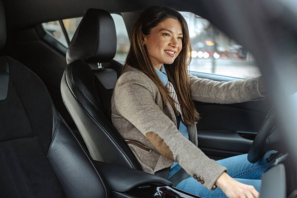istock Confident professional woman driving and smiling during a daytime commute 2209587470