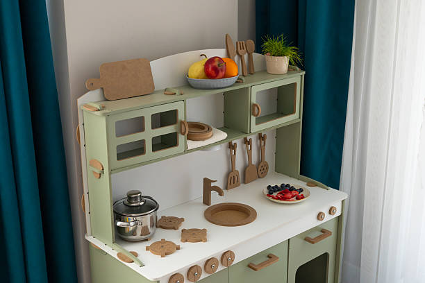 istock Children's cardboard kitchen set featuring utensils and play food, perfect for imaginative cooking and pretend play 2209592343