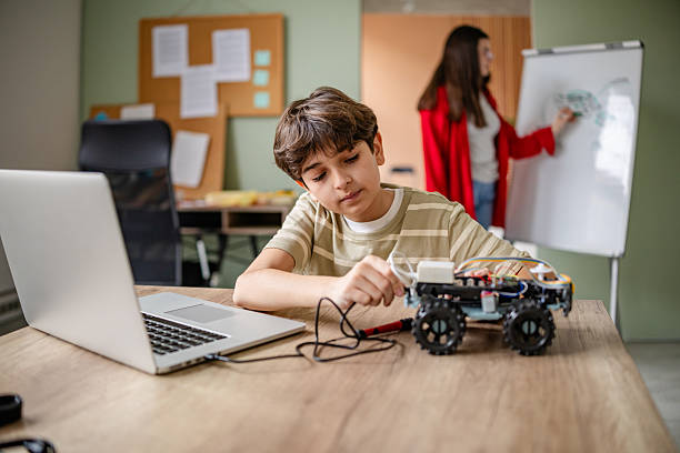 istock Kids engaged in robotics class designing and building innovative robots, showcasing creativity and teamwork 2209592532