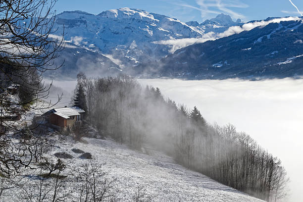 Sea of ​​clouds in the French mountains on a beautiful sunny winter day.