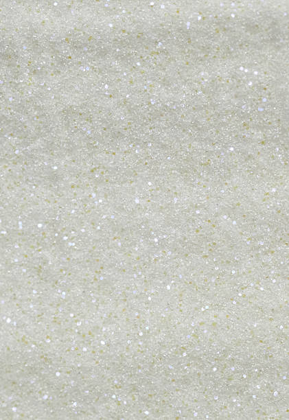 istock Shiny white texture with sequins and sparkling effect. Macro image of white texture with shining sequins and shimmering effect. Abstract background with glitter and festive mood 2209595419