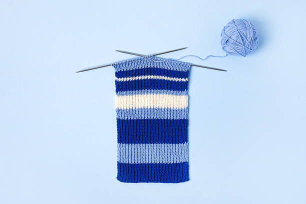 istock Knitted scarf and a ball of thread 2209596739