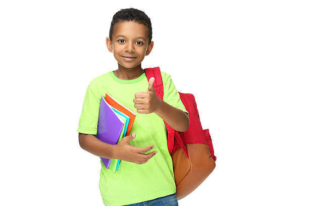 istock Young African American school boy with notepads and backpack on white background 2209598372