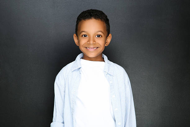 istock Young African American boy on black background 2209599014