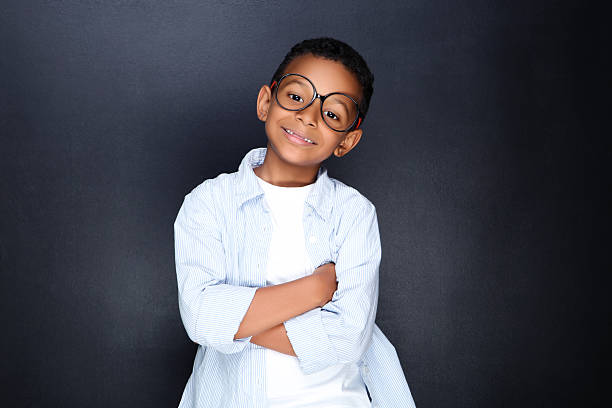 Baby boy wearing huge glasses. Isolated on white. 
