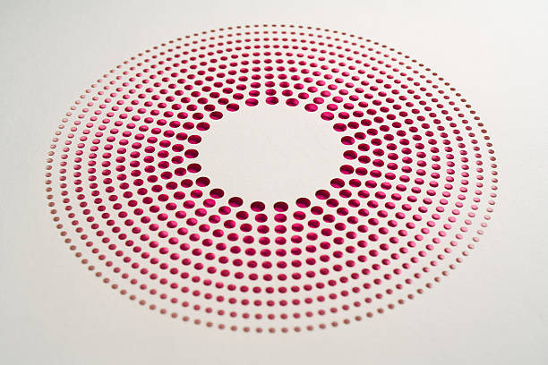 istock Modern circular paper cut artwork with radial dot pattern revealing vibrant magenta layer beneath clean white paper surface 2209600009