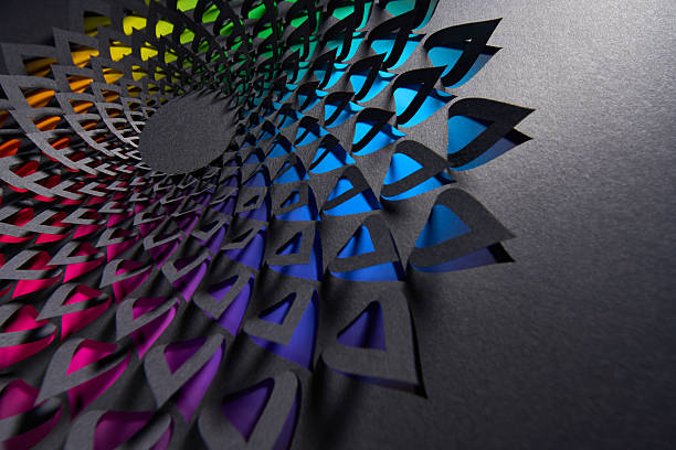 istock Vibrant teardrop mandala paper cut artwork with layered rainbow colors beneath intricate black cutouts in circular formation 2209600057