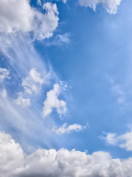 istock White fluffy clouds streaking across azure sky, showcasing tranquil atmospheric beauty with soft, wispy movement 2209602596