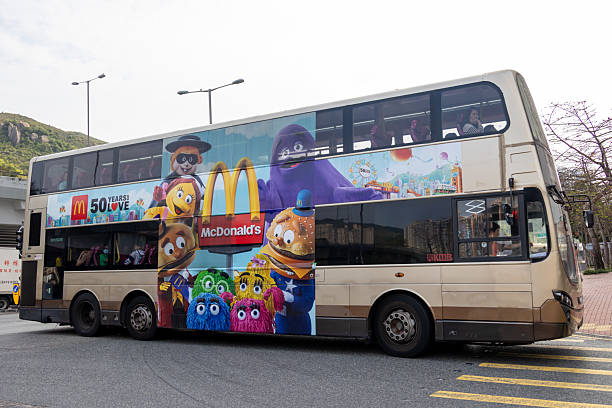 Hong Kong - April 10, 2025 : A bus displays a commercial advertisement of the McDonald's restaurant marks its 50th anniversary in Hong Kong.