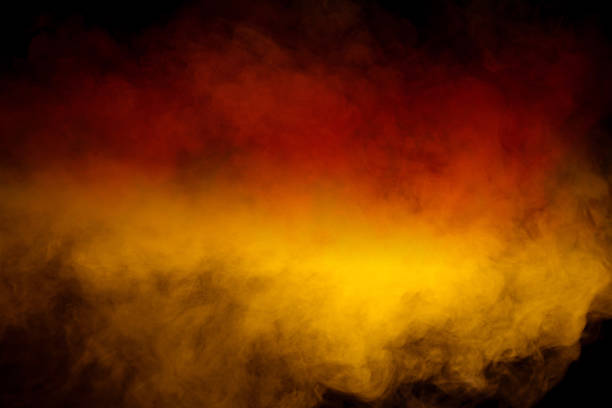 Orange and red steam on a black background. Copy space.