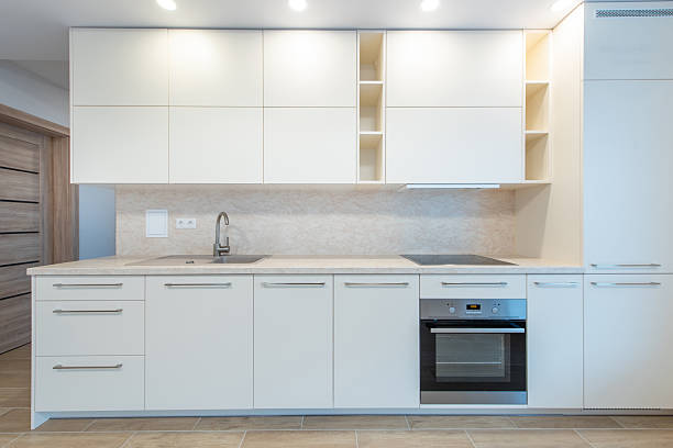 istock Modern Home Minimalist Kitchen Interior With White Cabinets and Built-In Appliances 2209604010
