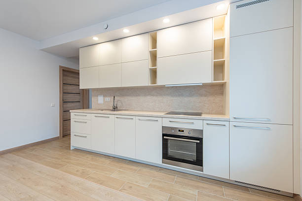 istock Modern Home Minimalist Kitchen Interior With White Cabinets and Built-In Appliances 2209604059