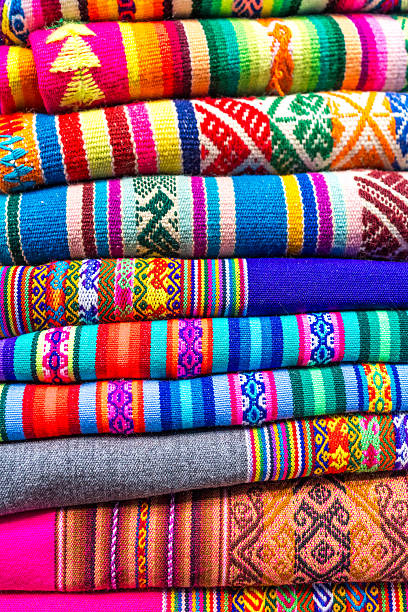 TRADITIONAL PERUVIAN TEXTILES WITH BRIGHT COLORS AND ANDEAN PATTERNS