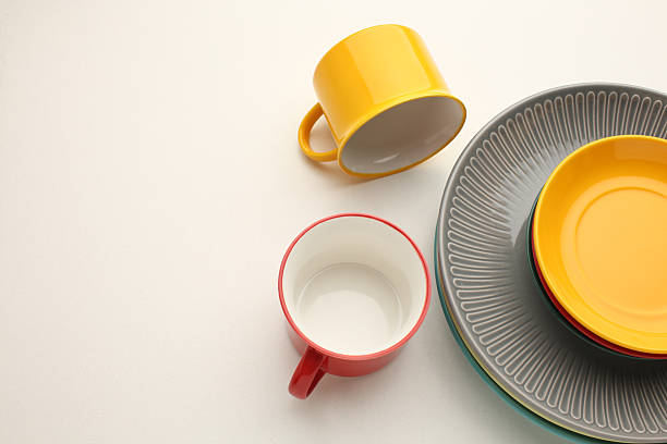 istock Beautiful multi-coloured bright ceramic bowl and tarenes, on a table top view 2209605933