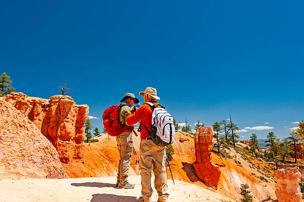 Bryce Canyon, Utah - May 16, 2021: Hikers exploring the Bryce Canyon National Park, located in Utah state. The red, orange, and white colors of the rocks provide spectacular views for park visitors.