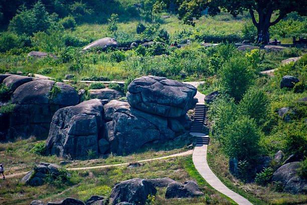 istock Rocky Landscape With Hikers Enjoying Nature in a Forested Area on Devil's Den 2209611476