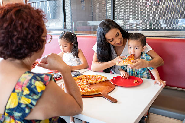 istock Family eating together 2209614528