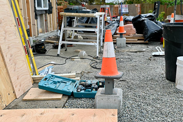 PORPHYRY STONE CUBES FOR PAVING AND LANDSCAPING IN A CONSTRUCTION SITE - Natural cobblestone blocks with rough surface, perfect for construction, flooring, outdoor design, and architectural background