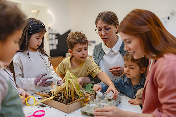 istock Diverse preschool children explore gardening and nature with teachers, using soil and plants for a fun hands-on learning activity focused on environmental awareness and teamwork. 2209615023