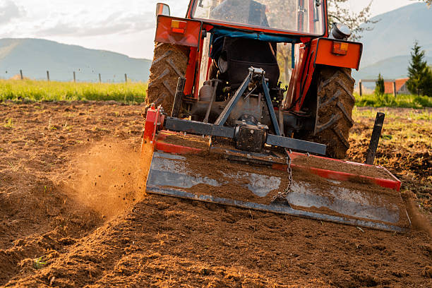istock Farmer in tractor sowing crops at agricultural fields in spring. 2209615568