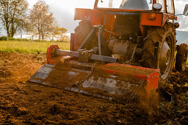 istock Tractor sowing crops at agricultural fields in spring. 2209615880