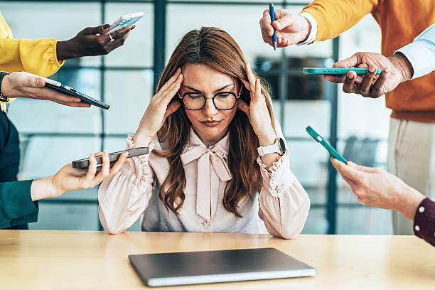 istock Overwhelmed Professional in a Busy Environment 2209619859