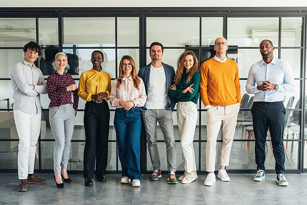 istock Diverse Team of Professionals Standing Together in a Modern Office 2209619863