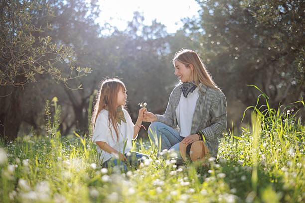 istock Carefree young mother and daughter hugging in spring day. 2209621571