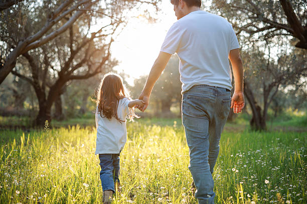 istock Carefree young father and daughter hugging in spring day. 2209622988
