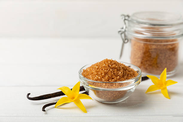 istock Aromatic vanilla sugar. Vanilla pods. Vanilla sticks, brown and white sugar in a bowl on a textured background. Vanilla flowers, spices and herbs for desserts and baking. Space for text. Copy space 2209623251
