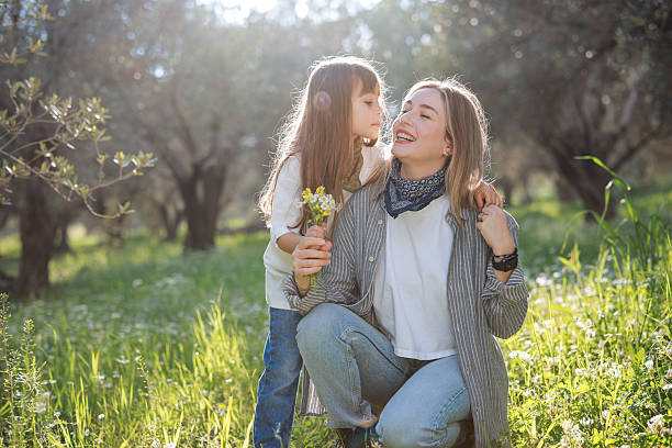 istock Carefree young mother and daughter hugging in spring day. 2209623766
